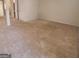 Large living area with neutral carpeting at 2103 Grove Way, Hampton, GA 30228