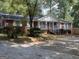 Brick ranch house with attached garage and landscaping at 4850 Lehigh Dr, Douglasville, GA 30135