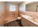 Retro bathroom with pink tile, bathtub, and updated flooring at 4850 Lehigh Dr, Douglasville, GA 30135
