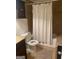 Bathroom with shower/tub combo and neutral tile at 4850 Lehigh Dr, Douglasville, GA 30135