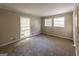 Spacious bedroom with ample natural light and carpet flooring at 4850 Lehigh Dr, Douglasville, GA 30135