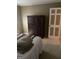 Well-lit bedroom featuring a large dresser and closet at 4850 Lehigh Dr, Douglasville, GA 30135