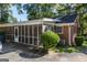 Brick house exterior with screened porch and landscaping at 4850 Lehigh Dr, Douglasville, GA 30135