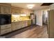 Retro kitchen with ample cabinet space and updated flooring at 4850 Lehigh Dr, Douglasville, GA 30135