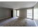 Large living room with neutral carpeting and natural light at 4850 Lehigh Dr, Douglasville, GA 30135