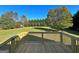 Spacious deck overlooking a large, grassy backyard at 217 Point Ridge Ct, Temple, GA 30179