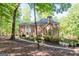 Brick house with a large backyard deck and beautiful landscaping at 270 Emerald Lake Dr, Fayetteville, GA 30215