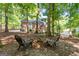 Spacious backyard with fire pit and wooded area at 270 Emerald Lake Dr, Fayetteville, GA 30215