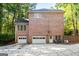 Brick house with two-car garage and landscaped yard at 270 Emerald Lake Dr, Fayetteville, GA 30215