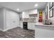 Basement kitchenette with white cabinets and granite counters at 270 Emerald Lake Dr, Fayetteville, GA 30215