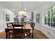 Spacious dining room with a wood table and chairs, and access to the kitchen at 270 Emerald Lake Dr, Fayetteville, GA 30215
