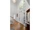 Two-story entryway featuring hardwood floors, a grand staircase, and ample natural light at 270 Emerald Lake Dr, Fayetteville, GA 30215