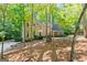 Brick home situated on a wooded lot with a large driveway at 270 Emerald Lake Dr, Fayetteville, GA 30215