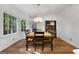 Bright dining room featuring a wood table and chairs, and large windows at 270 Emerald Lake Dr, Fayetteville, GA 30215