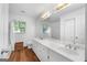 Clean bathroom with double vanity and wood-look floors at 270 Emerald Lake Dr, Fayetteville, GA 30215