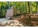 Brick home with attached garage and private driveway, nestled in woods at 270 Emerald Lake Dr, Fayetteville, GA 30215