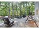 Spacious patio with seating area, surrounded by trees at 270 Emerald Lake Dr, Fayetteville, GA 30215