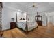 Spacious main bedroom with a post bed and ceiling fan at 270 Emerald Lake Dr, Fayetteville, GA 30215