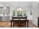 Charming dining room with wood table and chairs, and a view to the backyard at 270 Emerald Lake Dr, Fayetteville, GA 30215