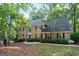 Two-story brick home with a welcoming front porch and landscaping at 270 Emerald Lake Dr, Fayetteville, GA 30215