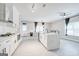 Modern kitchen with white shaker cabinets, large island, and stainless steel appliances at 2844 Riverchess Sw Ct, Atlanta, GA 30331