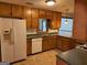 Kitchen with wood cabinets, laminate counters, and tile floor at 4112 Jodeco Rd, Stockbridge, GA 30281