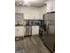 Modern kitchen with stainless steel appliances and white cabinets at 2734 Laurel View Dr, Snellville, GA 30039