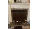 Fireplace with decorative screen and stone surround at 2734 Laurel View Dr, Snellville, GA 30039
