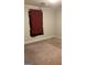 Simple bedroom with a window and neutral-colored carpet at 2734 Laurel View Dr, Snellville, GA 30039