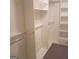 Spacious walk-in closet with ample shelving and hanging space at 2734 Laurel View Dr, Snellville, GA 30039
