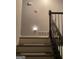 Staircase with dark wood railings and neutral carpeting at 2734 Laurel View Dr, Snellville, GA 30039