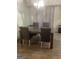 Dining room with dark wood table and gray chairs at 2734 Laurel View Dr, Snellville, GA 30039