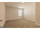 Spacious bedroom with carpeted floor and window at 298 Brooks Dr # 79, Fairburn, GA 30213