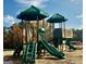 Green playground with slides and climbing features at 298 Brooks Dr # 79, Fairburn, GA 30213