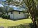 Side view of house showcasing clean lines and lawn at 415 Crabapple Rd, Fayetteville, GA 30215