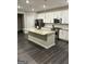 Modern kitchen with island, stainless steel appliances, and granite countertops at 4020 Red Canoe Bnd, Lilburn, GA 30047