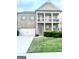 Two-story home with brick facade, two-car garage, and manicured lawn at 4020 Red Canoe Bnd, Lilburn, GA 30047