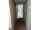Simple hallway with carpeted floors and access to rooms at 1505 Camelot Dr, College Park, GA 30349
