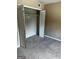 Simple bedroom with carpeted floors and built-in closet at 1505 Camelot Dr, College Park, GA 30349
