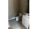 Simple bathroom with toilet, sink, and vanity at 1505 Camelot Dr, College Park, GA 30349