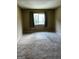 Spacious bedroom with neutral carpeting and large window at 1505 Camelot Dr, College Park, GA 30349
