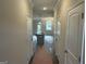 Bright hallway with access to several rooms and the living area at 2960 Fareed St, Douglasville, GA 30135