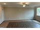 Spacious living room with neutral walls and wood-look flooring at 2960 Fareed St, Douglasville, GA 30135