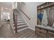 Modern staircase with metal balusters and wooden steps at 2721 Fareed St, Douglasville, GA 30135