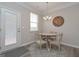 Cozy breakfast nook with a round table and four chairs, near a door at 2970 Fareed St, Douglasville, GA 30135