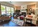 Comfortable living room with a fireplace and large windows at 2206 Sugar Maple Nw Ct, Acworth, GA 30101