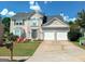 Two-story house with a double garage and landscaping at 2206 Sugar Maple Nw Ct, Acworth, GA 30101