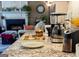Kitchen counter with granite top, coffee maker, and a view into the living room with fireplace at 2206 Sugar Maple Nw Ct, Acworth, GA 30101