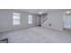 Spacious living room with neutral decor and hardwood floors at 115 Worthy Dr, Mcdonough, GA 30252