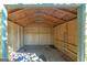 Unfinished storage shed with wood paneling at 115 Worthy Dr, Mcdonough, GA 30252